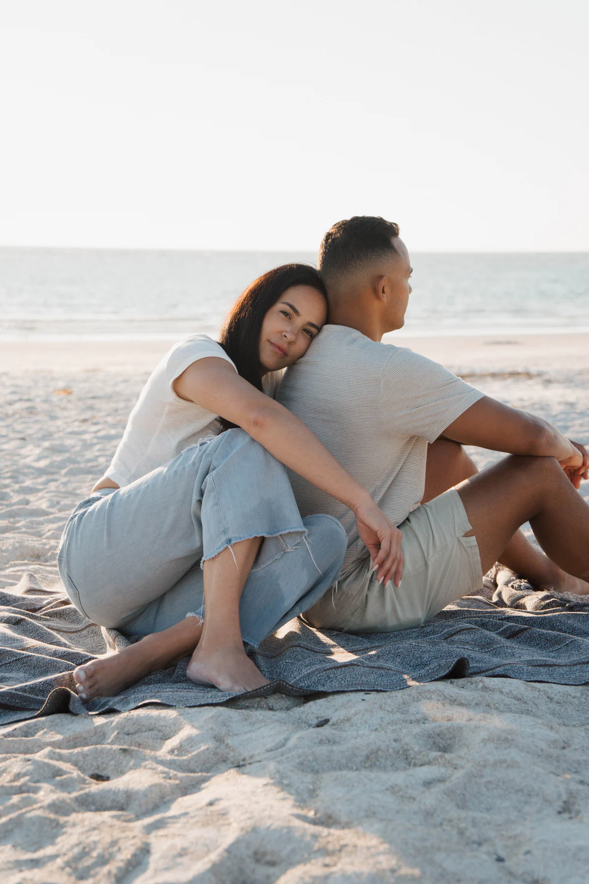Orlando engagement session couple embracing on the beach