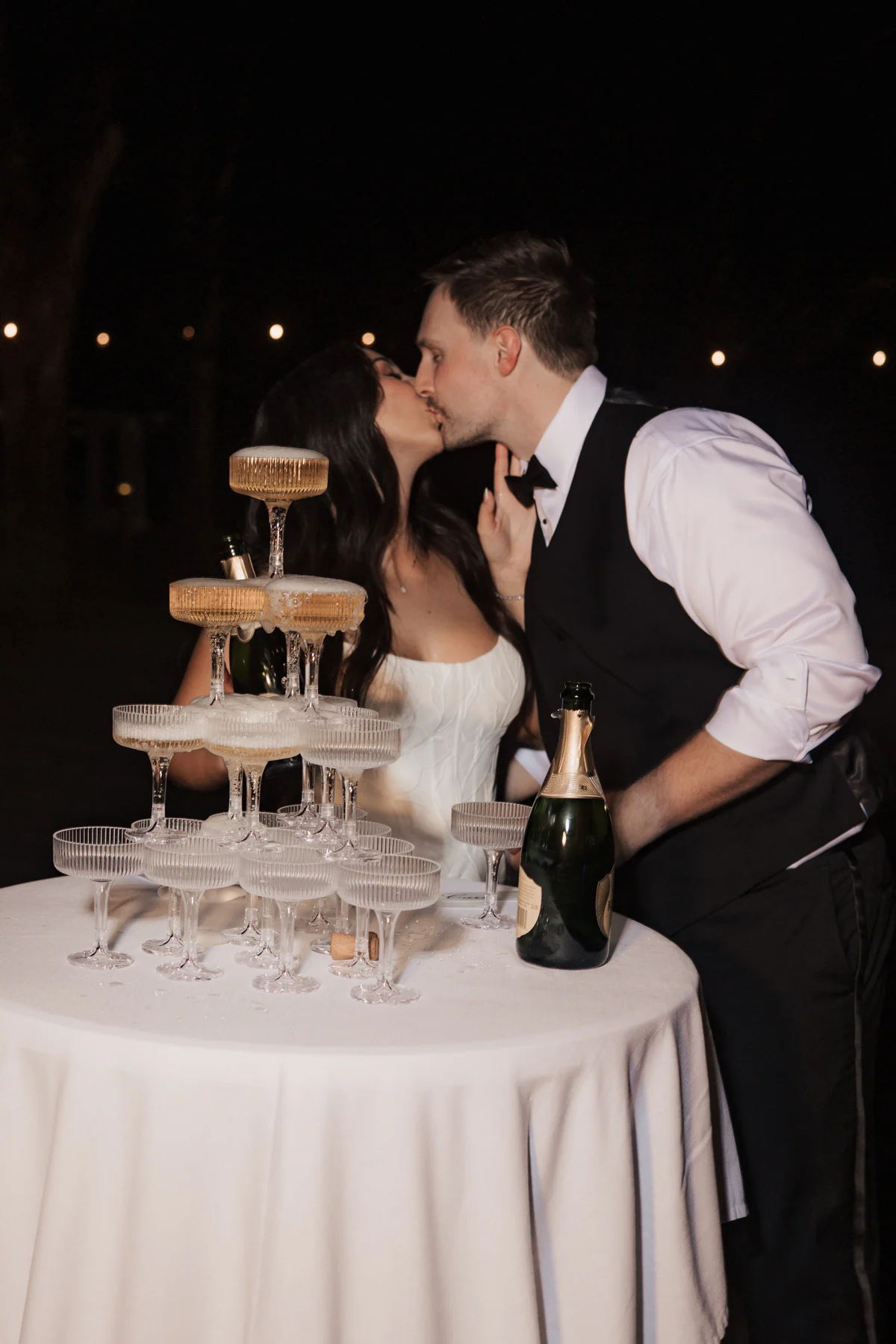 Orlando newlyweds celebrating beside a champagne tower