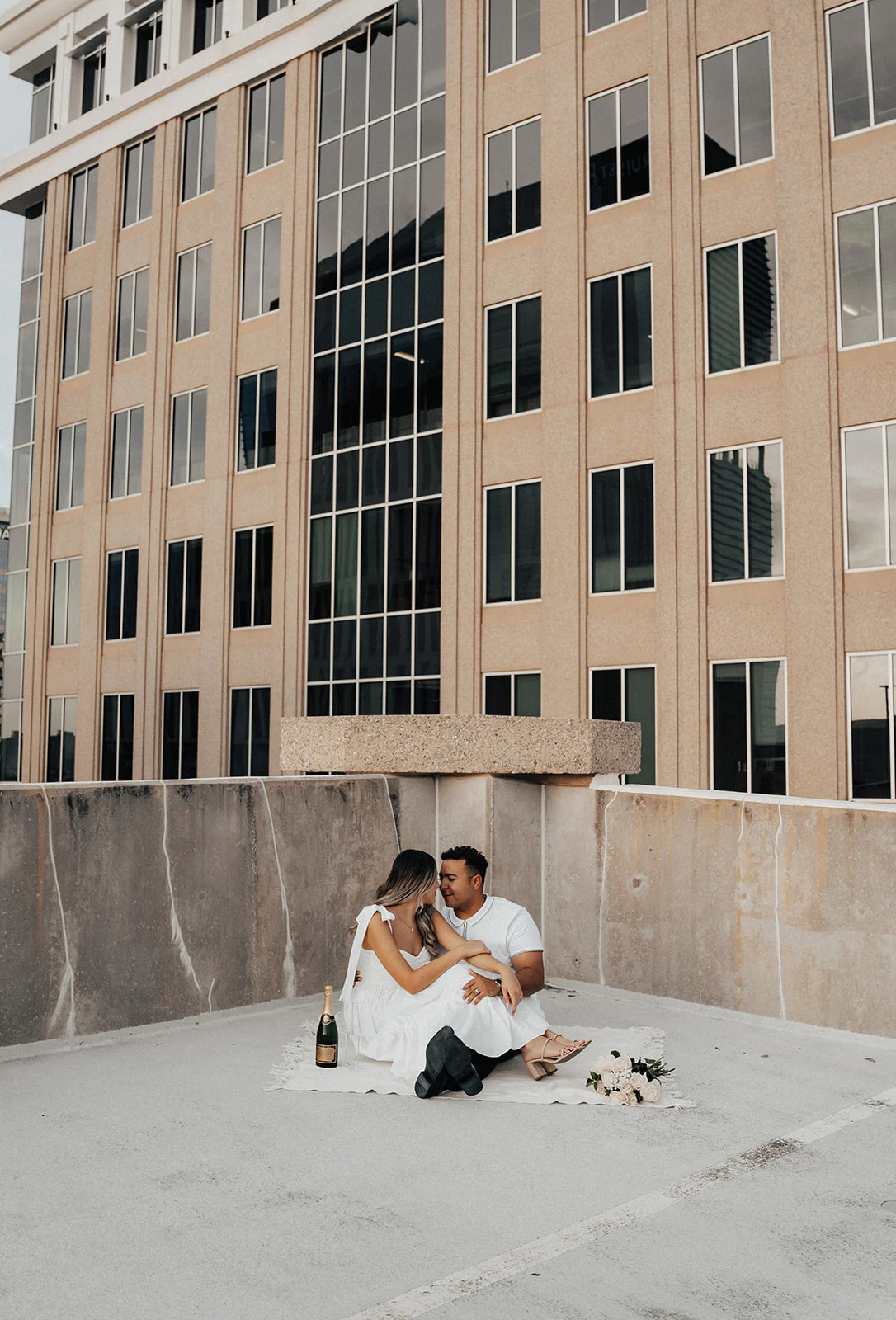 Downtown Orlando rooftop engagement portrait