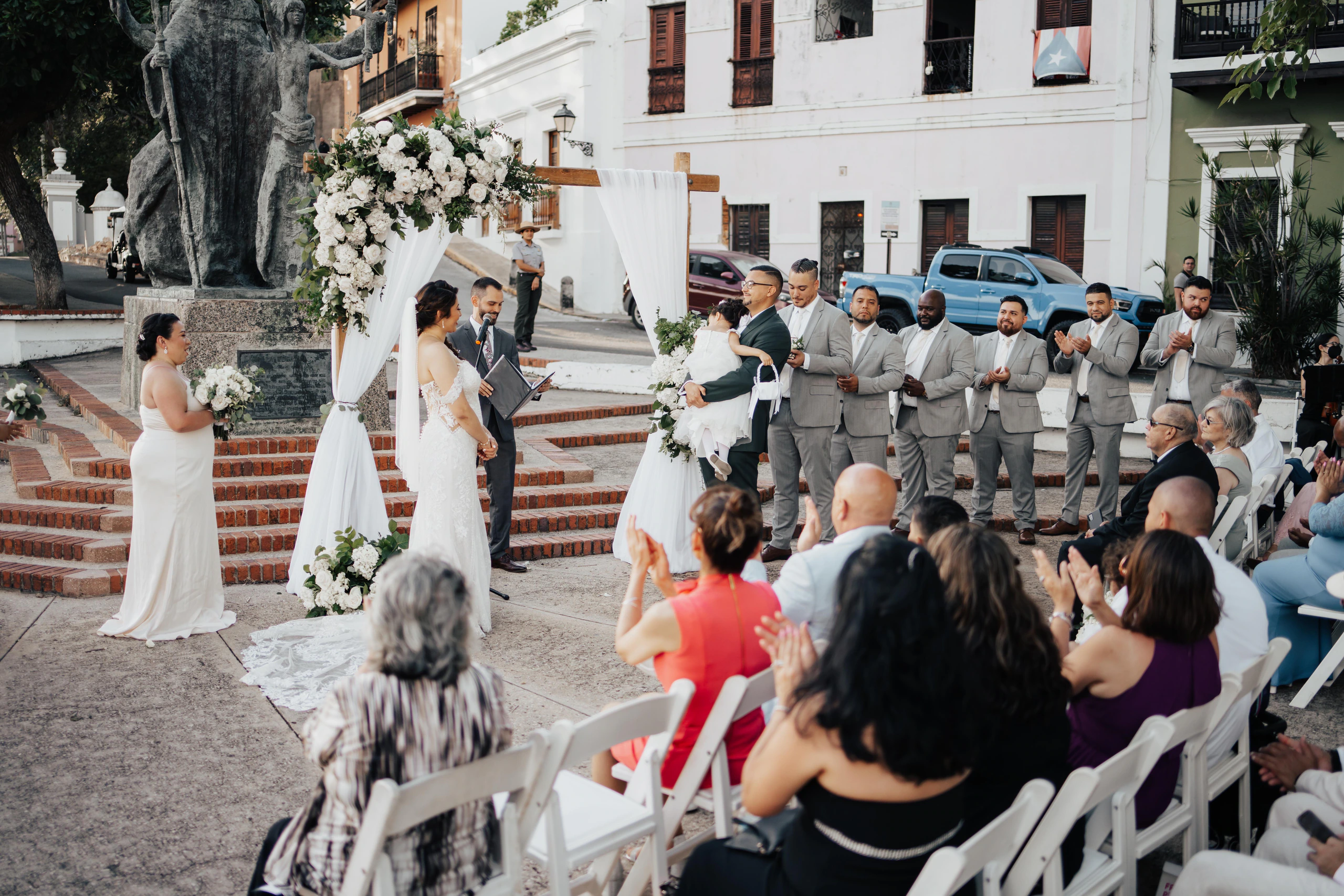Alexandra and Freddie's outdoor wedding ceremony on the brick steps beside Hotel El Convento in Old San Juan, Puerto Rico